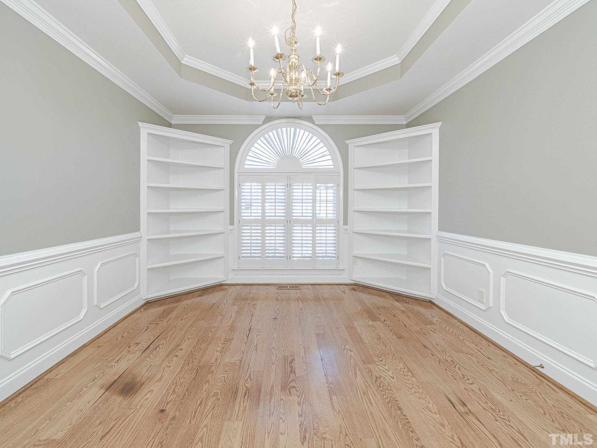 726 Pope Lake Road Angier, NC 27501 - Photo 13 of 29 a view of empty room with wooden floor and fan
