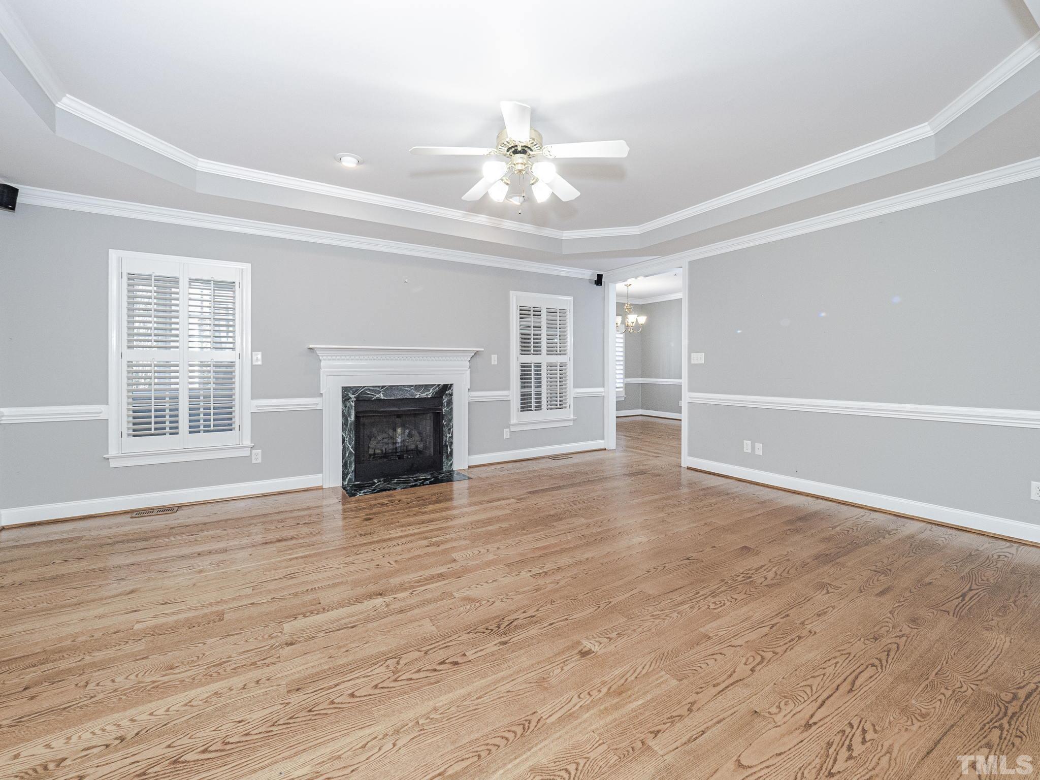 726 Pope Lake Road Angier, NC 27501 - Photo 14 of 29 a view of an empty room with wooden floor fireplace and a window