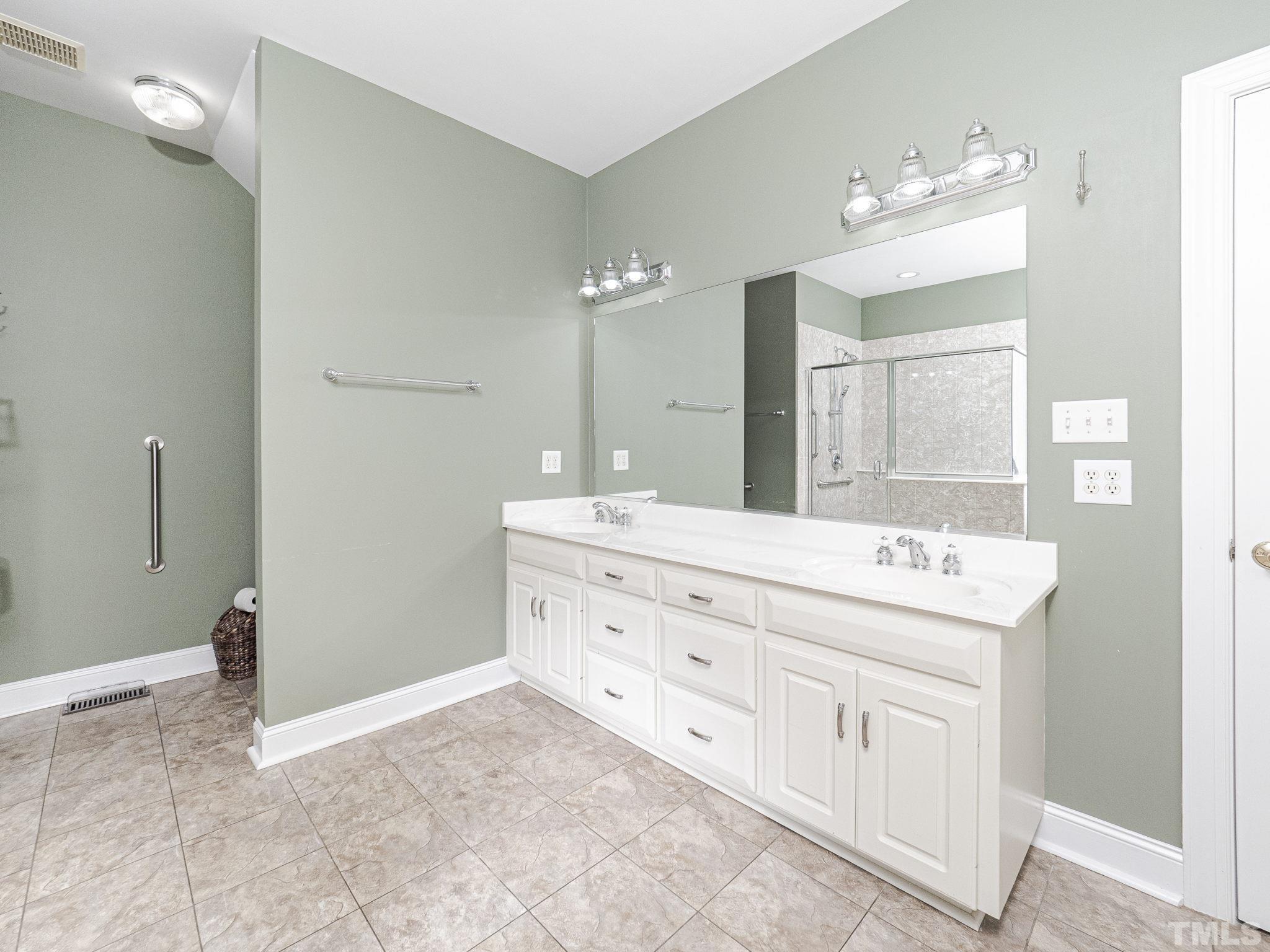 726 Pope Lake Road Angier, NC 27501 - Photo 19 of 29 a bathroom with a sink double vanity and a mirror