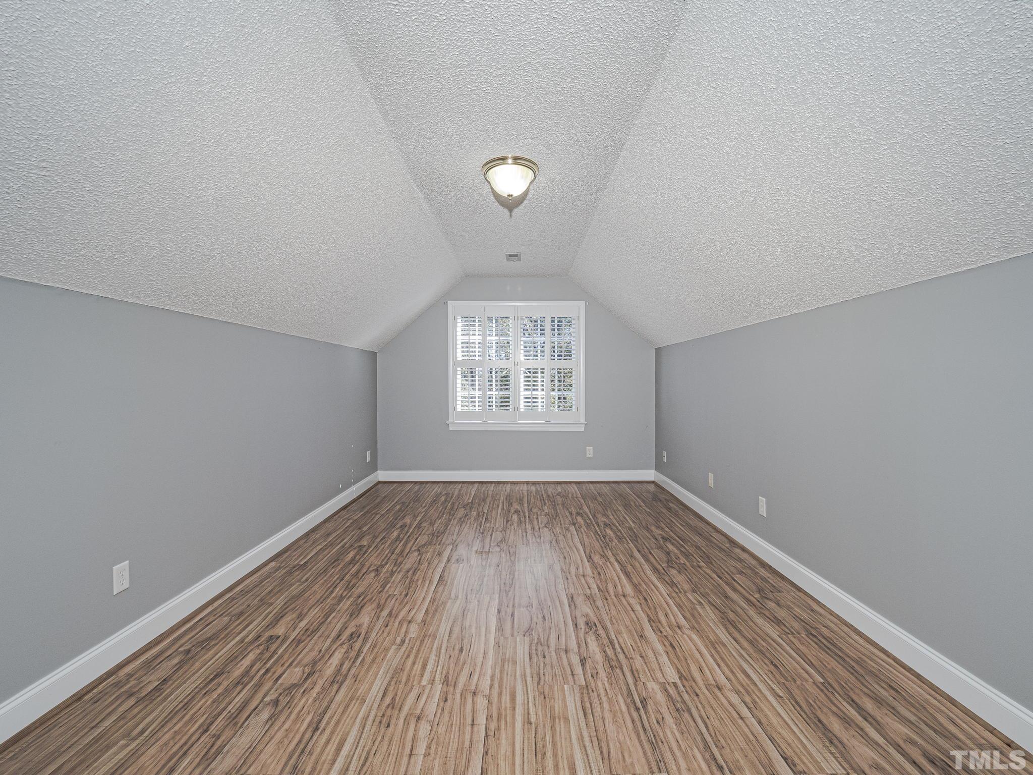 726 Pope Lake Road Angier, NC 27501 - Photo 20 of 29 wooden floor in an empty room with a window