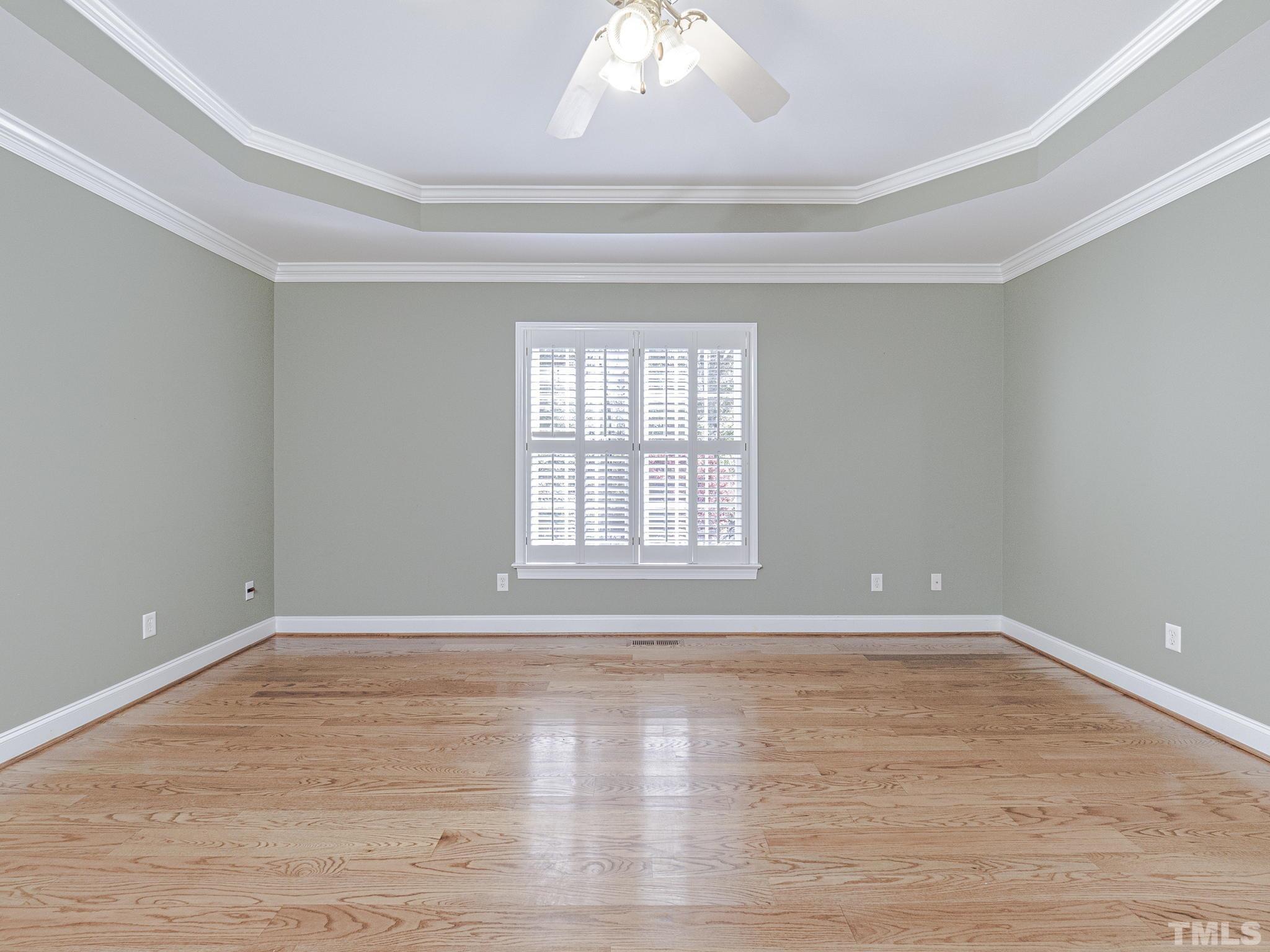 726 Pope Lake Road Angier, NC 27501 - Photo 24 of 29 a view of an empty room with wooden floor and a window