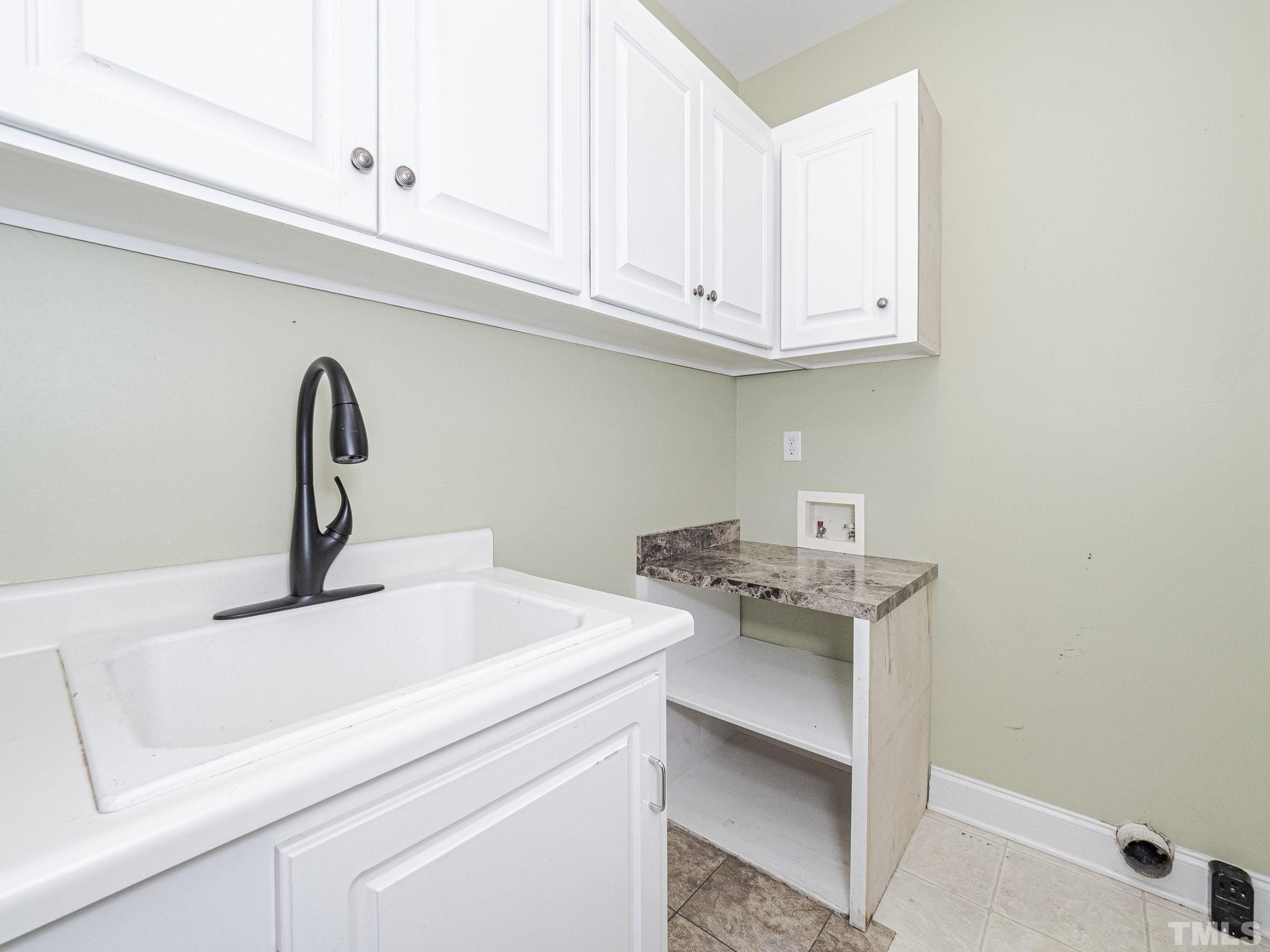 726 Pope Lake Road Angier, NC 27501 - Photo 25 of 29 a close view of a sink and cabinets in a room