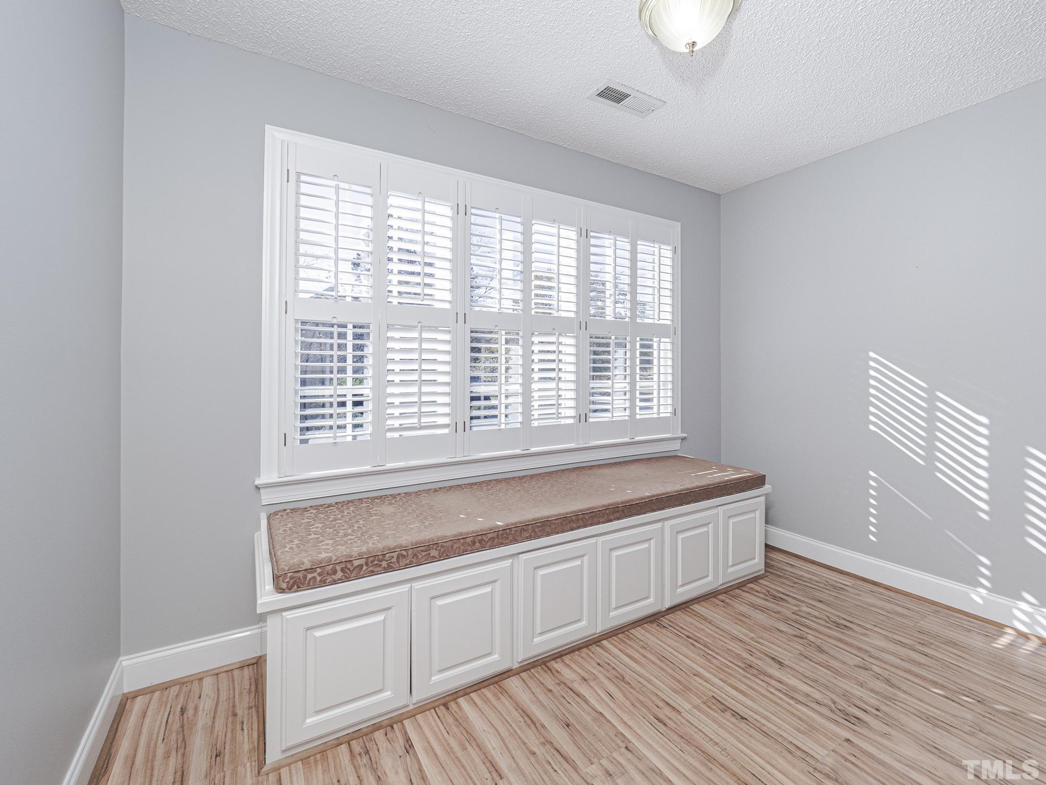 726 Pope Lake Road Angier, NC 27501 - Photo 28 of 29 a spacious bathroom with a large window and vanity
