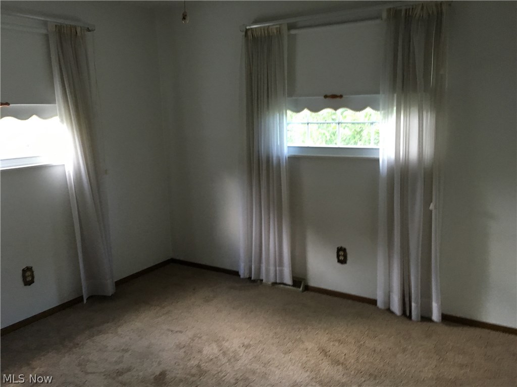 3137 Bates Road Madison, OH 44057 - Photo 15 of 17 Bedroom 2. Great lighting to go along with two closets for storage. New carpet installed in 2016.