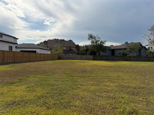 a view of a large pool with a yard