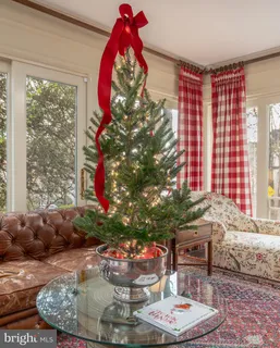 a bathroom with a sink shower and a mirror