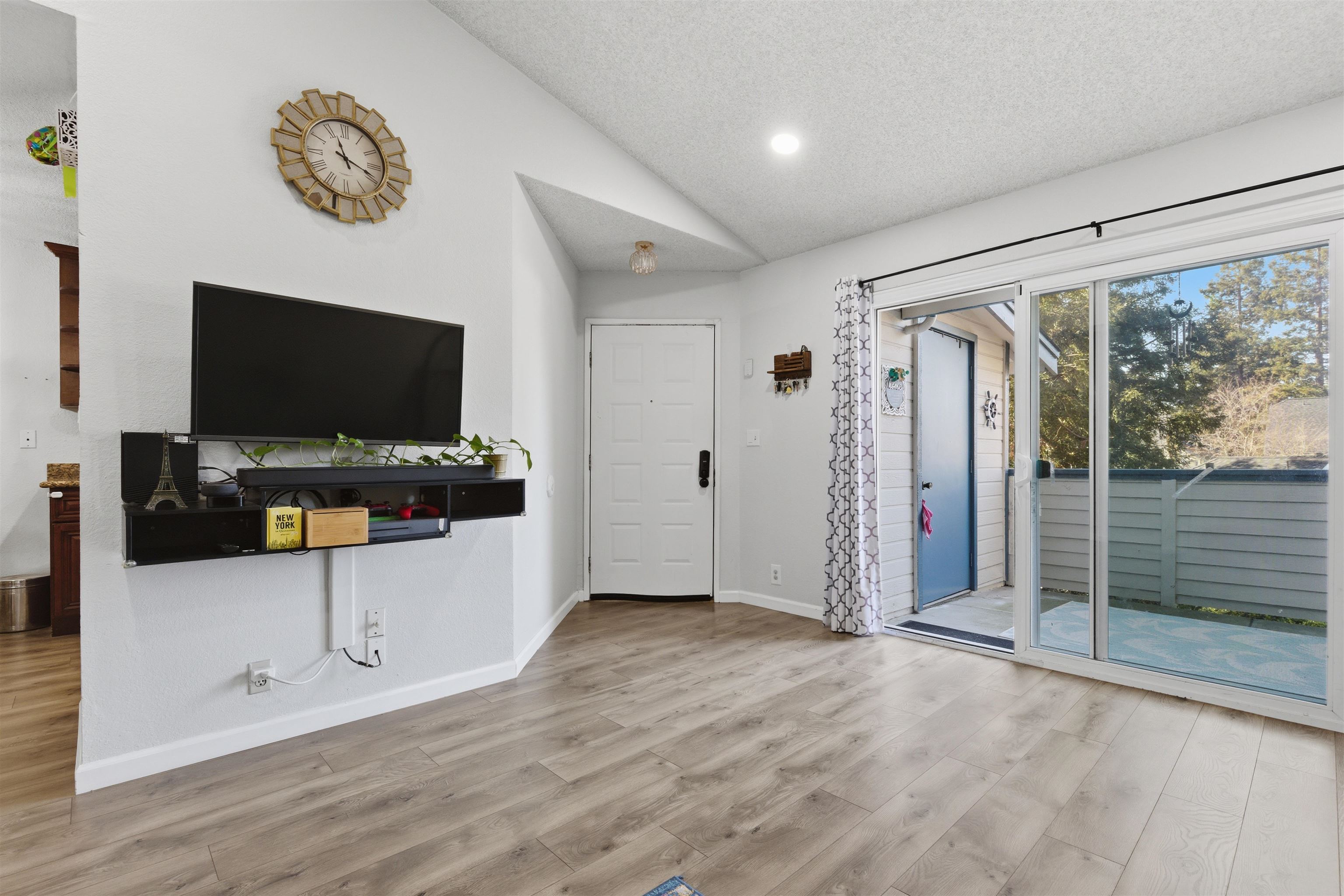 370 Sequim Common Fremont, CA 94539 - Photo 18 of 28 a view of a livingroom with wooden floor and flat screen tv