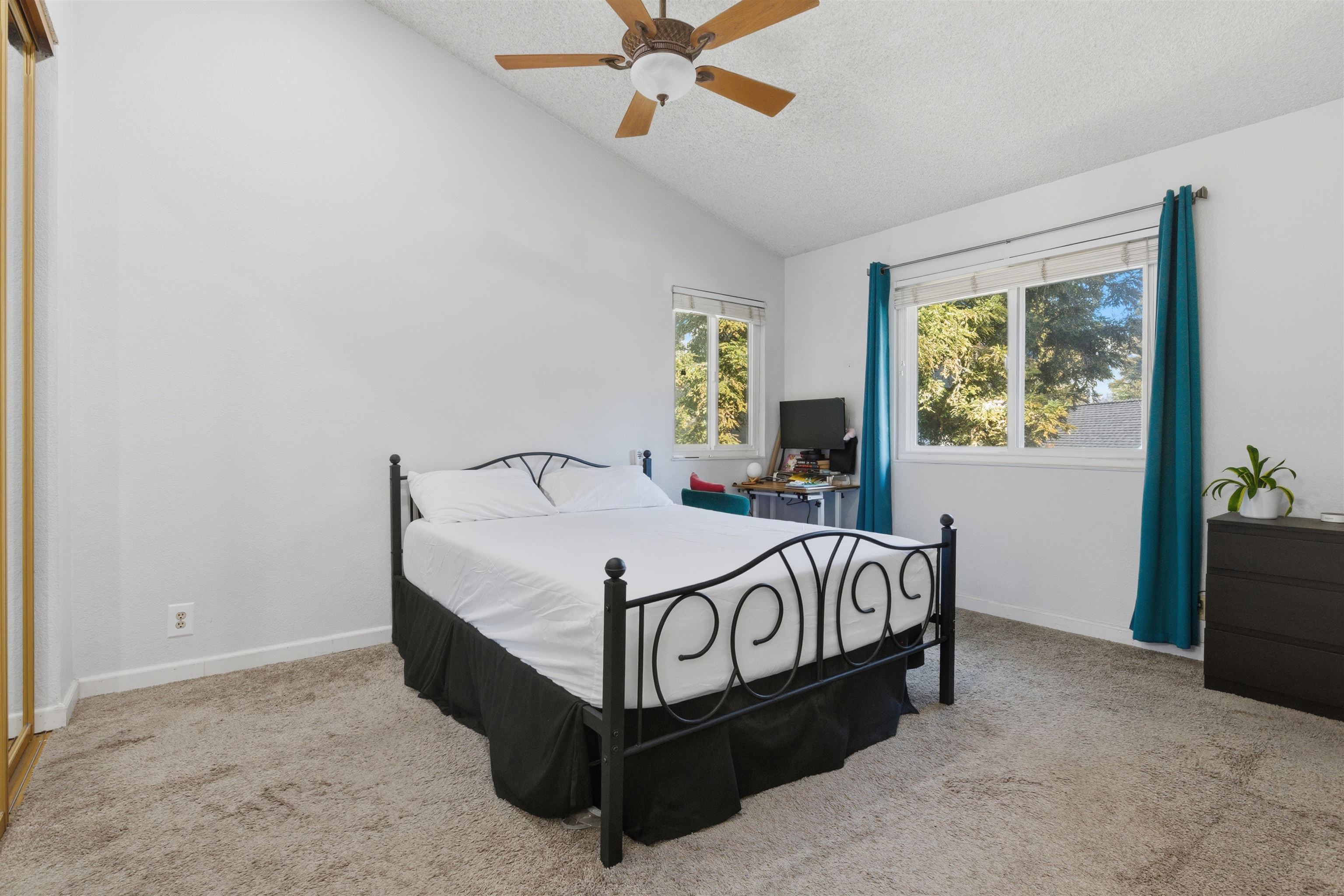 370 Sequim Common Fremont, CA 94539 - Photo 27 of 28 a bed sitting in a bedroom next to a window
