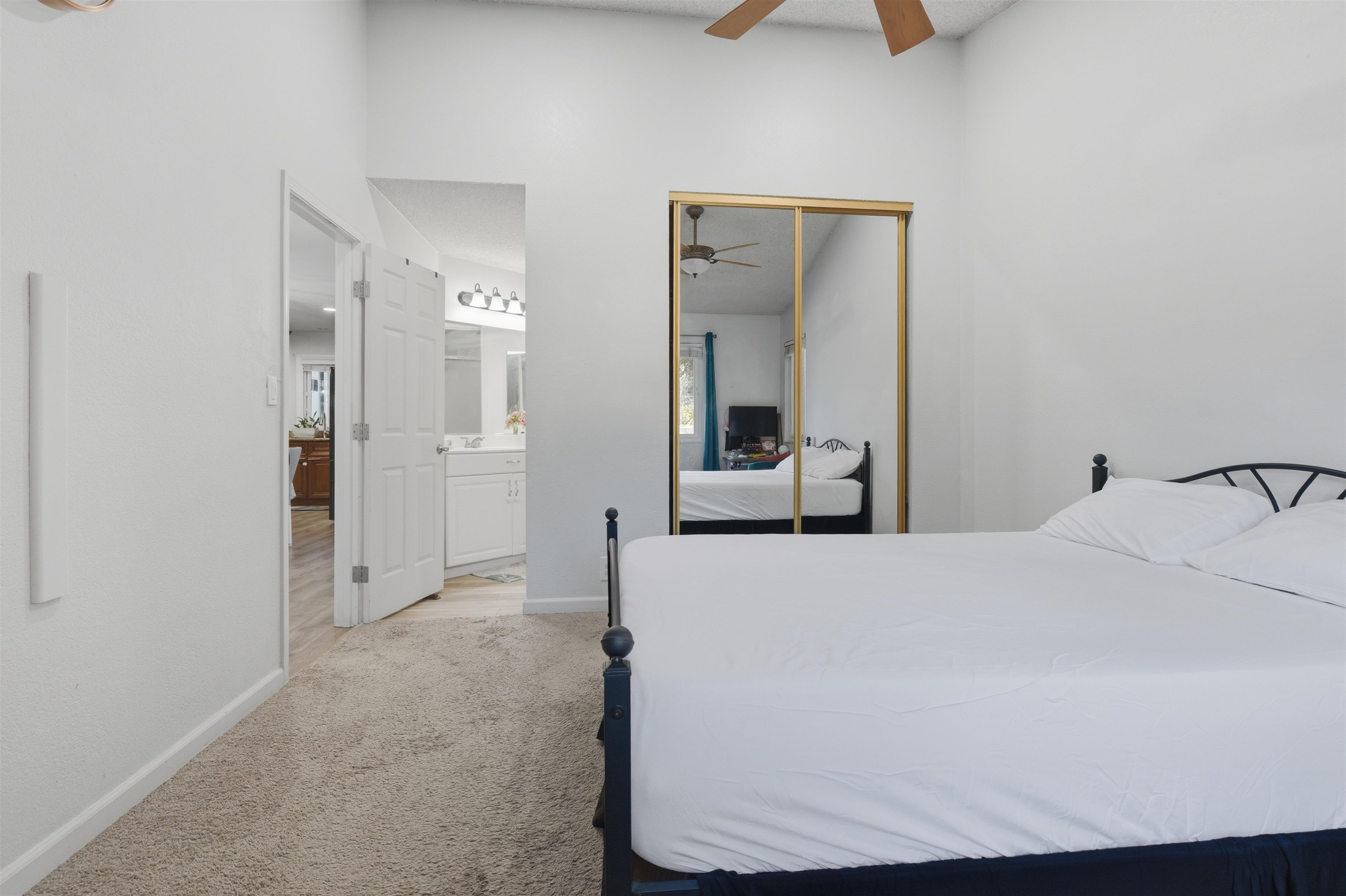 370 Sequim Common Fremont, CA 94539 - Photo 3 of 28 a bedroom with a bed and a mirror