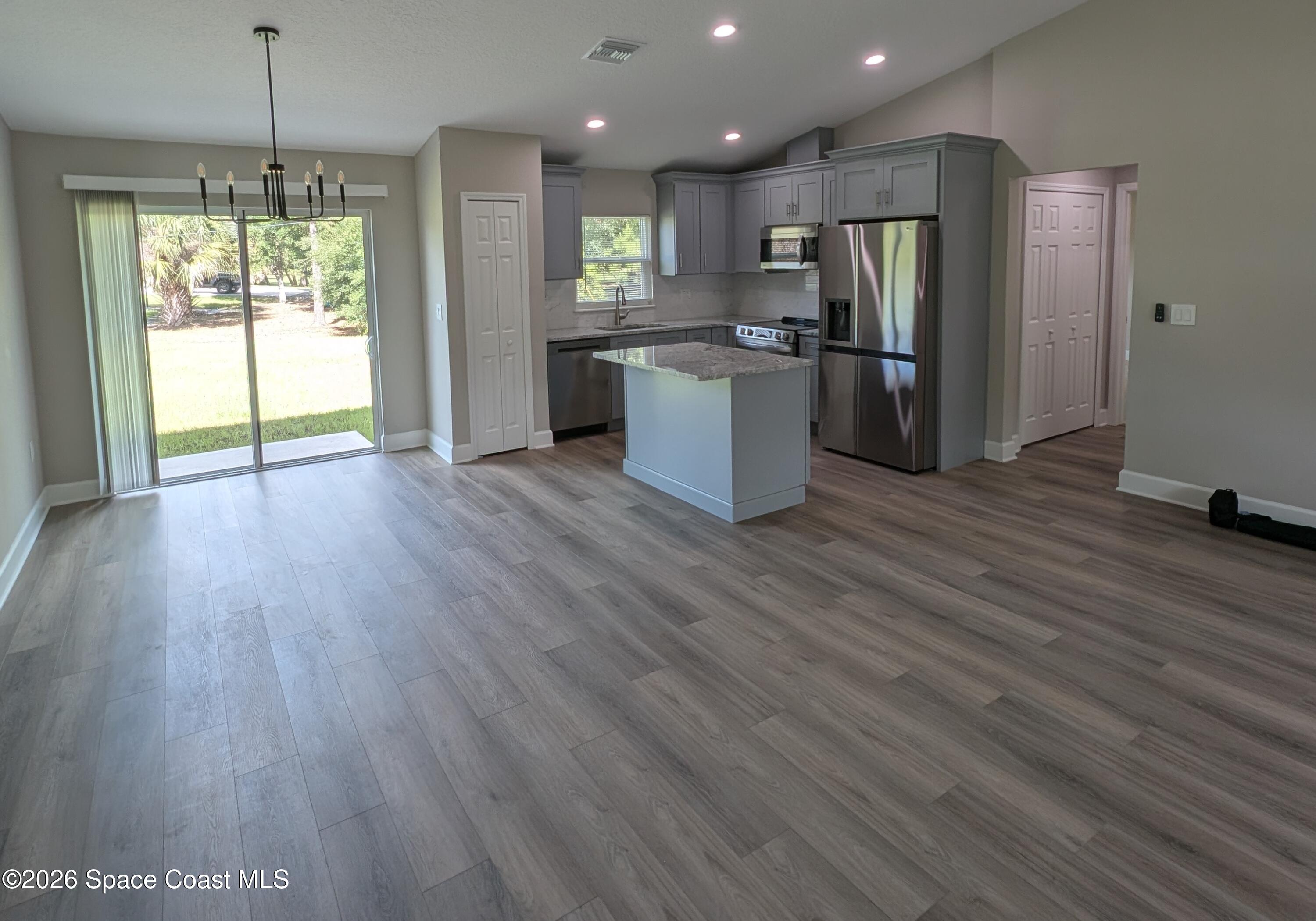 1356 Torgerson Road Southeast Palm Bay, FL 32909 - Photo 2 of 46 Dining room and Kitchen Crop