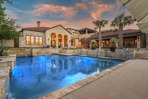 a view of a house with swimming pool