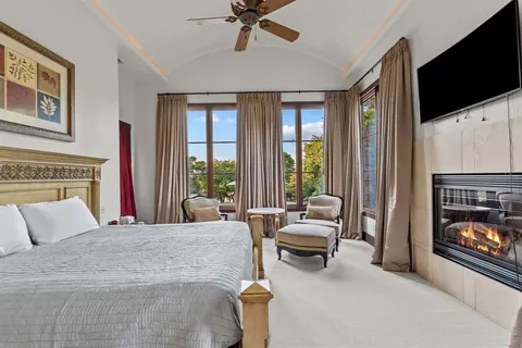 a living room with furniture fireplace and flat screen tv