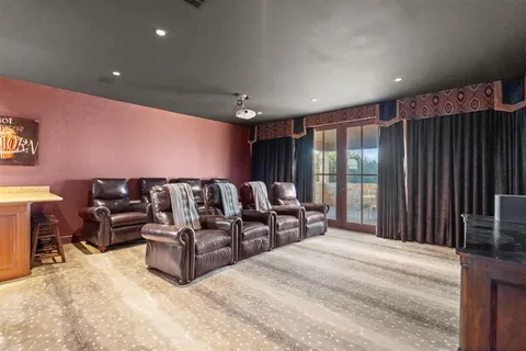 a spacious bedroom with a bed and large cabinets