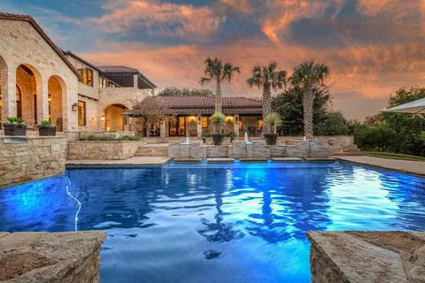 a swimming pool view with a outdoor seating