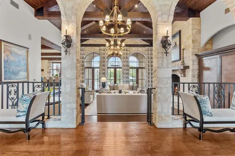 a view of a livingroom with furniture and hardwood floor