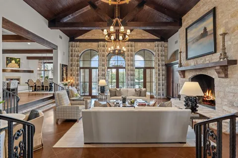a view of living room with furniture and chandelier