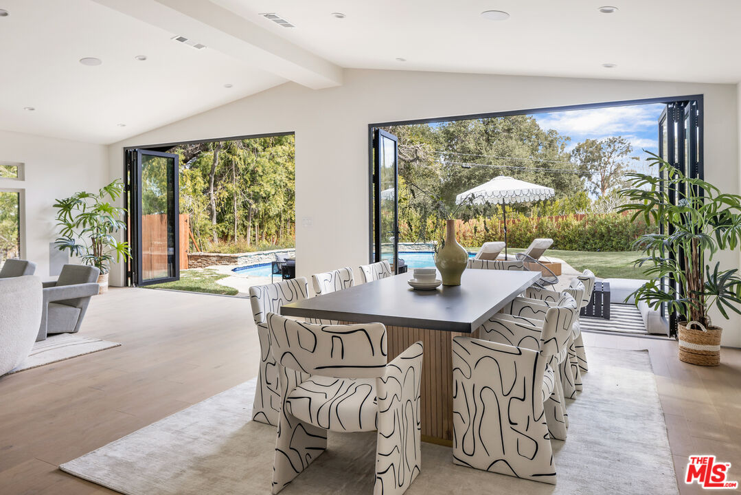 17140 Rancho Street Encino, CA 91316 - Photo 12 of 28 a view of a dining room with furniture window and outside view