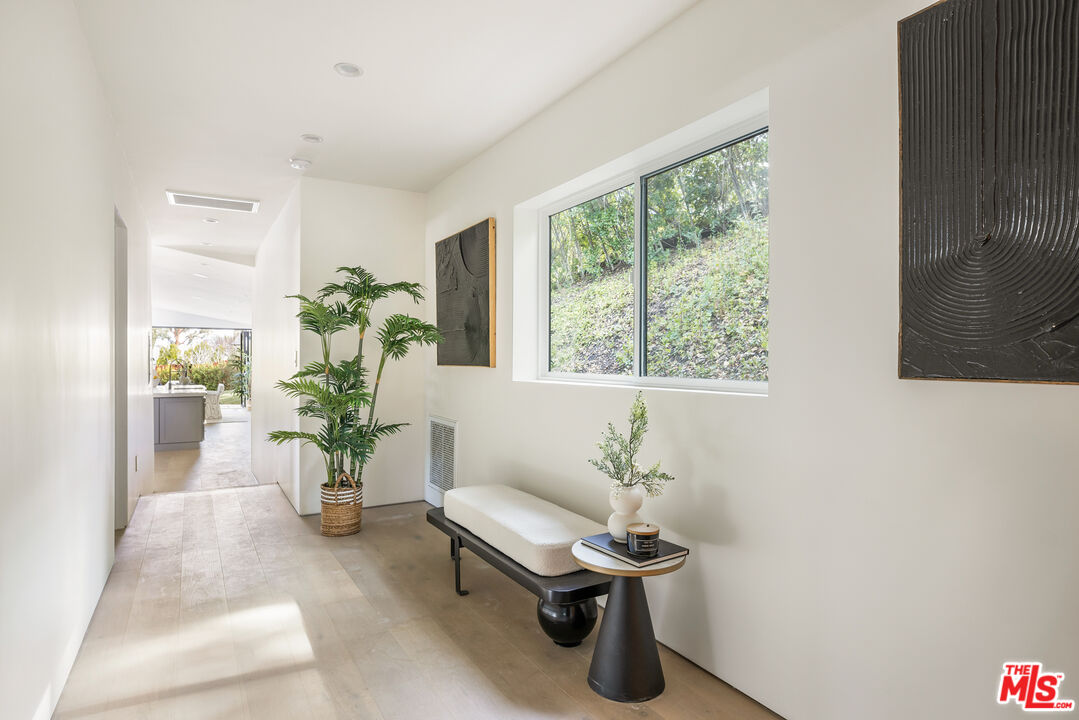 17140 Rancho Street Encino, CA 91316 - Photo 13 of 28 a view of a room with furniture and a potted plant