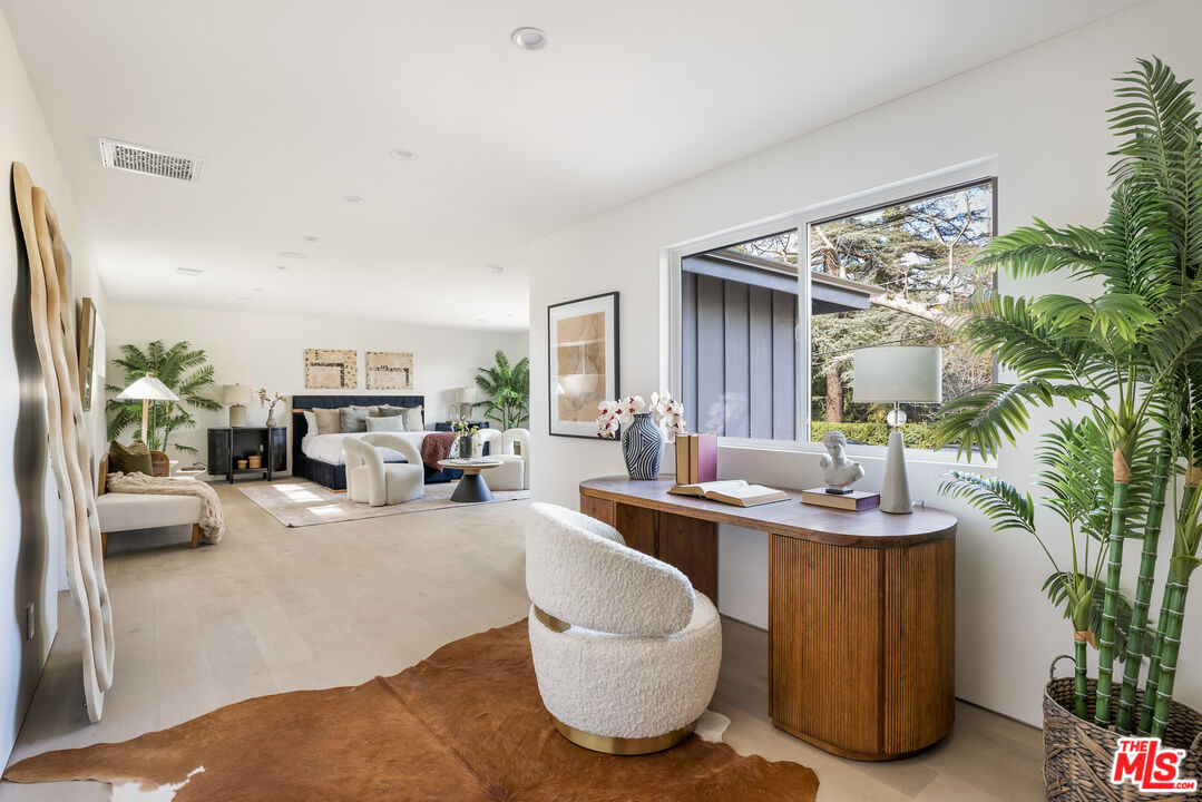 17140 Rancho Street Encino, CA 91316 - Photo 15 of 28 a living room with furniture and a large window
