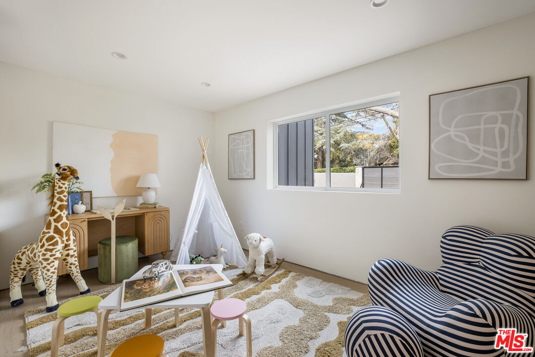 17140 Rancho Street Encino, CA 91316 - Photo 22 of 28 a view of a livingroom with furniture and window