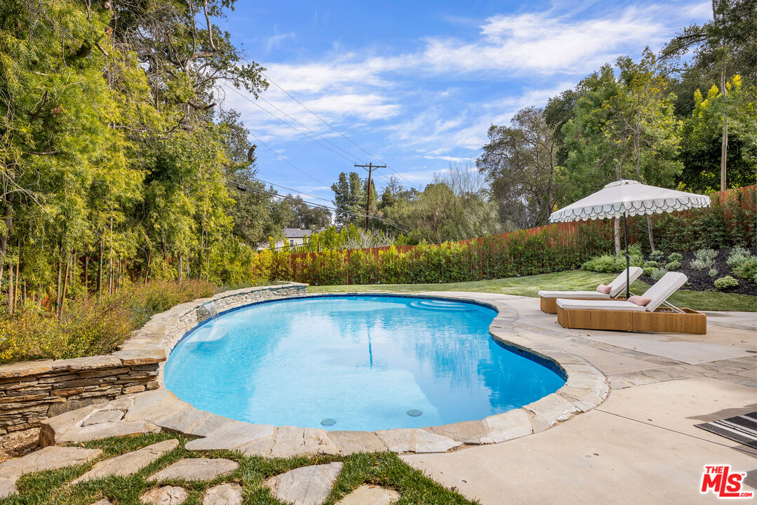 17140 Rancho Street Encino, CA 91316 - Photo 26 of 28 a view of swimming pool with a patio