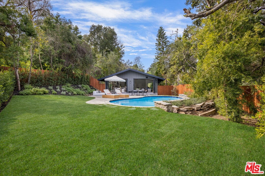 17140 Rancho Street Encino, CA 91316 - Photo 28 of 28 a front view of house with yard and green space