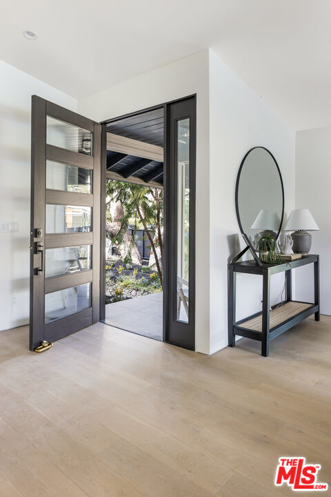 17140 Rancho Street Encino, CA 91316 - Photo 4 of 28 a view of a livingroom with furniture and front door