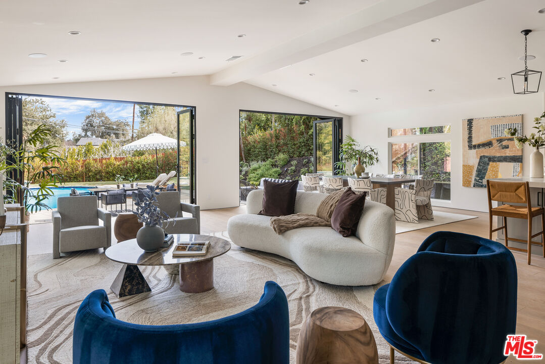 17140 Rancho Street Encino, CA 91316 - Photo 8 of 28 a living room with furniture and a large window