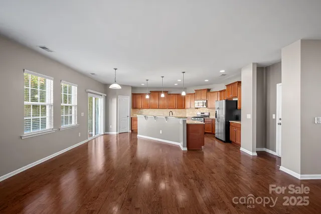 a view of kitchen with wooden floor