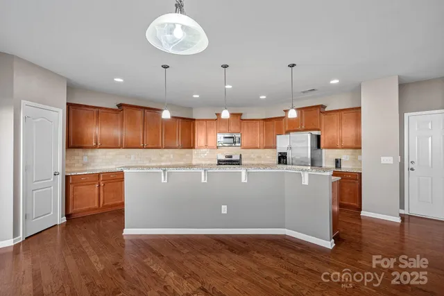 a view of kitchen with wooden floor