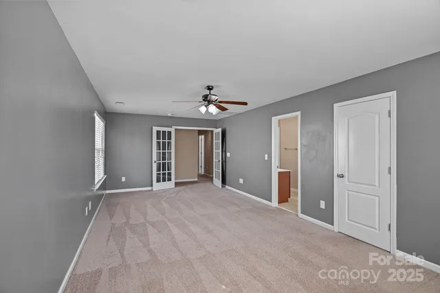 a bathroom with a sink shower and a mirror
