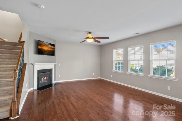 a view of livingroom with furniture fireplace and window