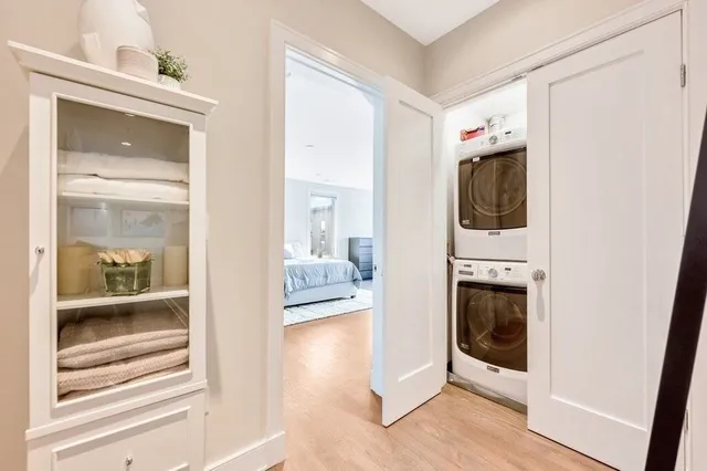 a view of a hallway with washer and dryer
