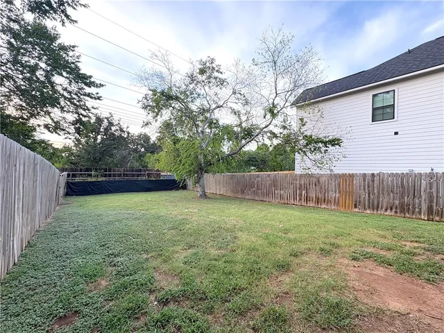 a view of a backyard with a trees