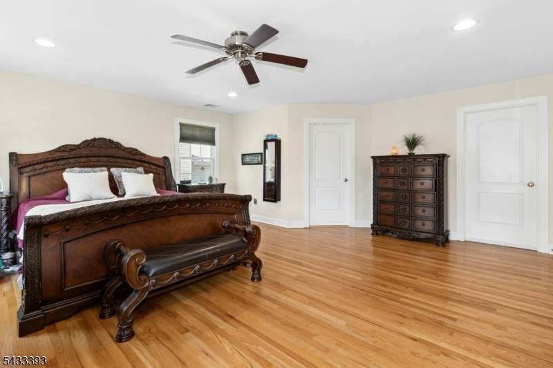 33 Stanton Street Clark, NJ 07066 - Photo 21 of 37 a bedroom with a bed and wooden floor