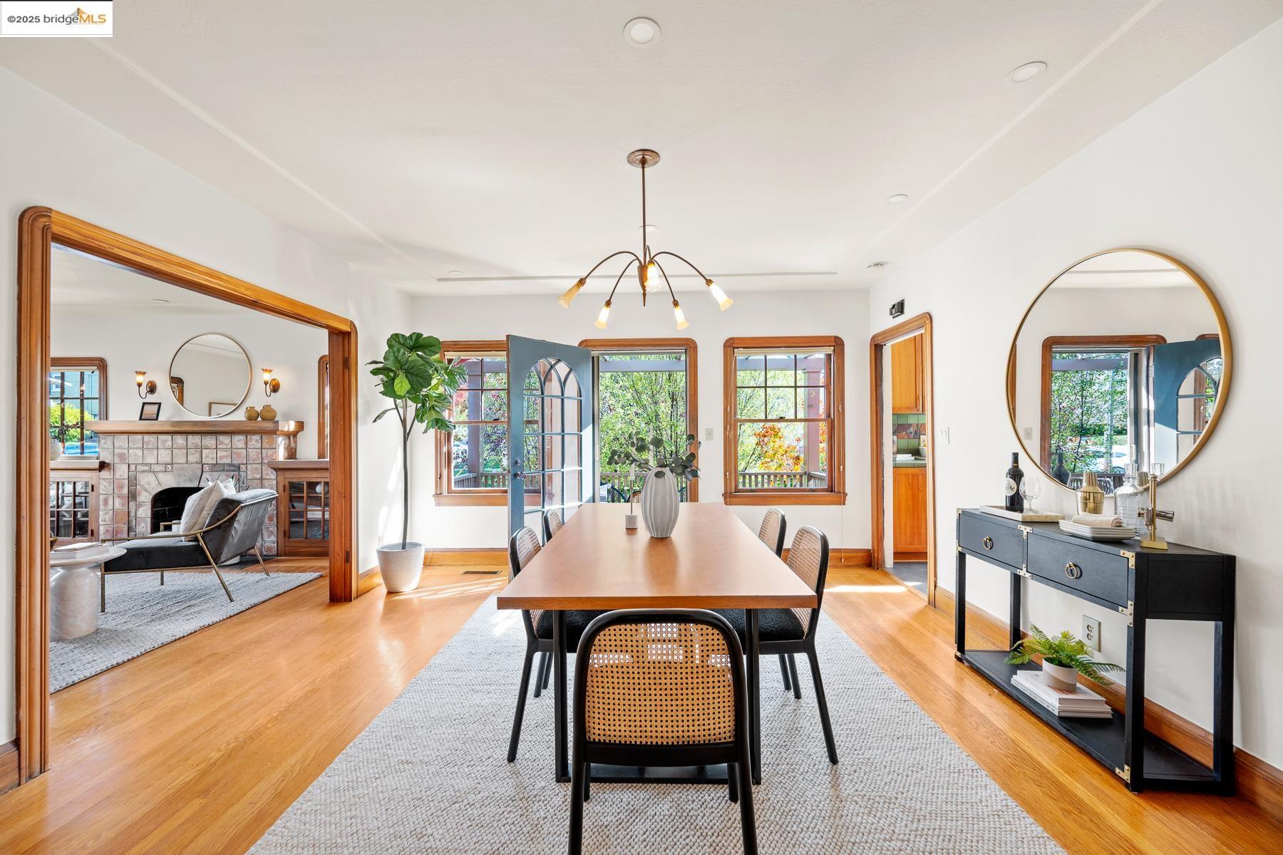 1614 Posen Avenue Berkeley, CA 94707 - Photo 16 of 60 a dining room with furniture a chandelier and wooden floor