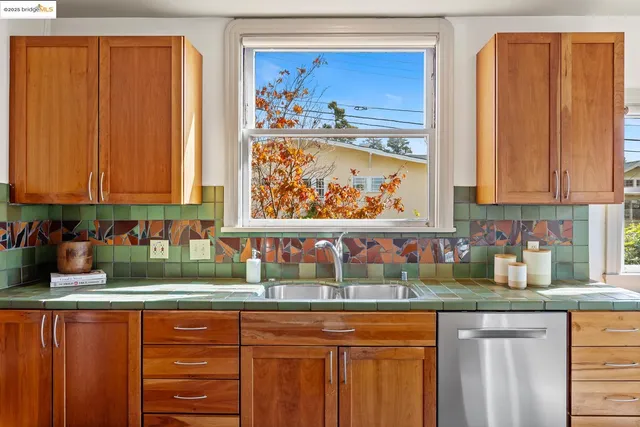 a kitchen with stainless steel appliances granite countertop a stove and a microwave