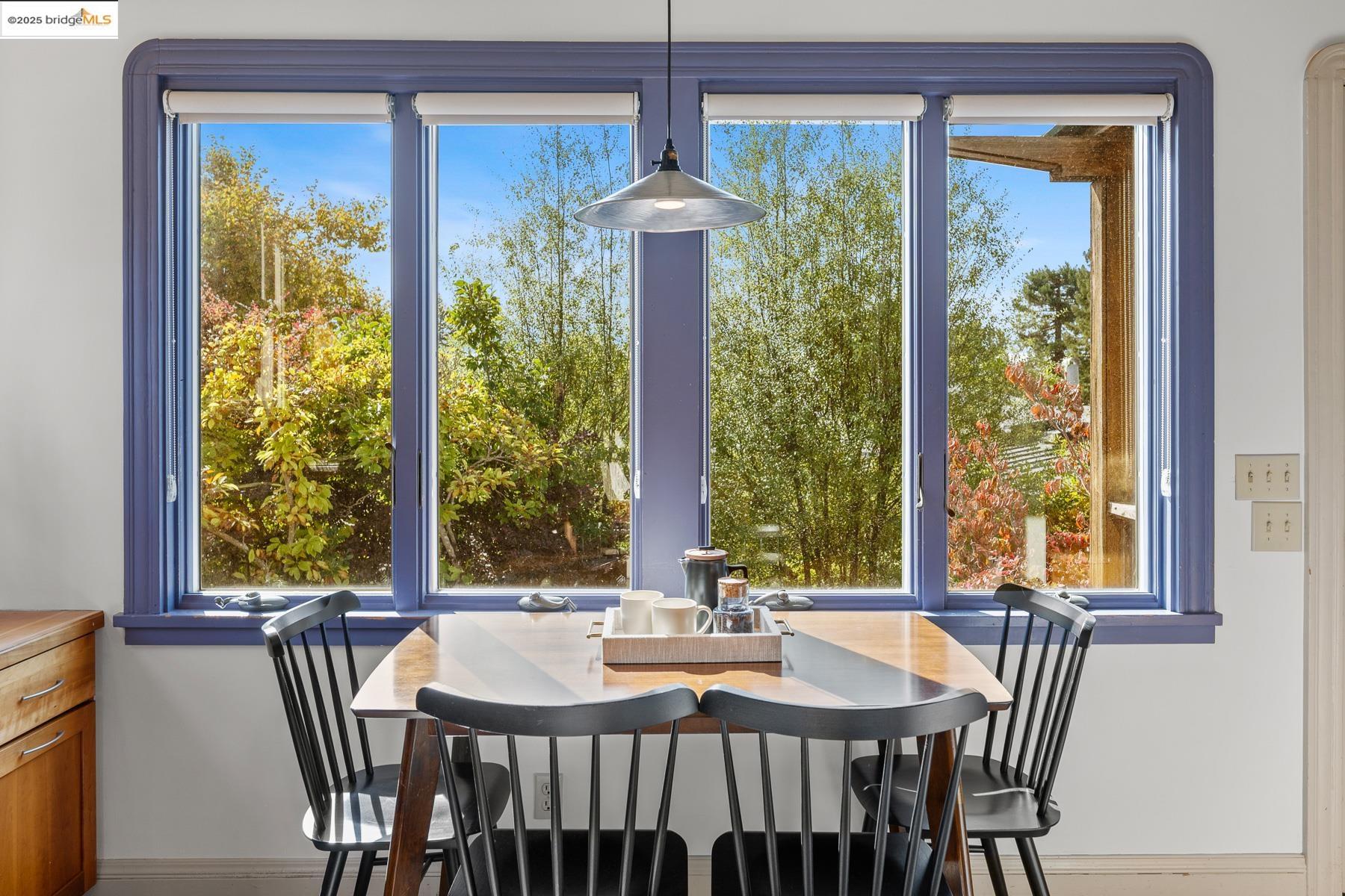 1614 Posen Avenue Berkeley, CA 94707 - Photo 21 of 60 a view of a dining room with furniture large windows and wooden floor