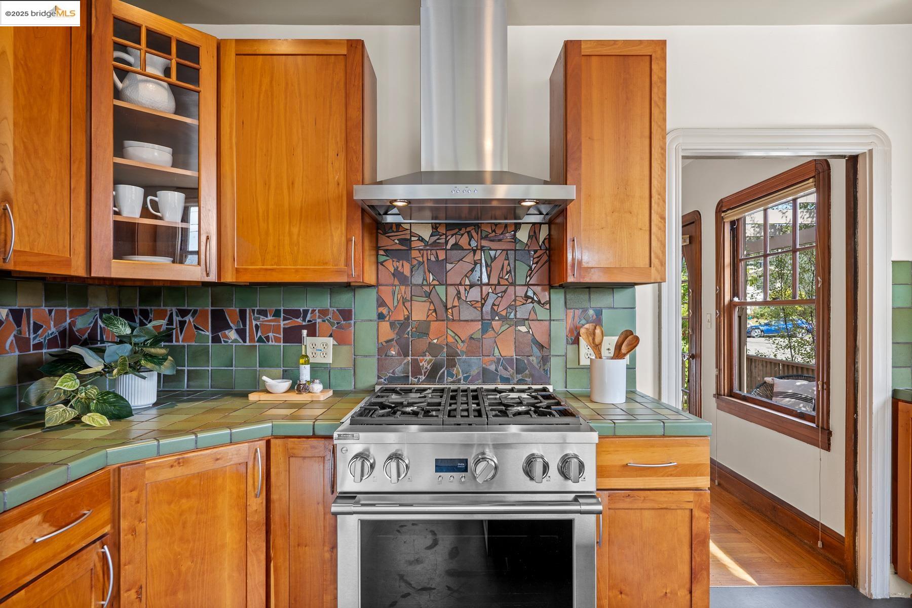 1614 Posen Avenue Berkeley, CA 94707 - Photo 25 of 60 a kitchen with stainless steel appliances granite countertop a stove and a microwave