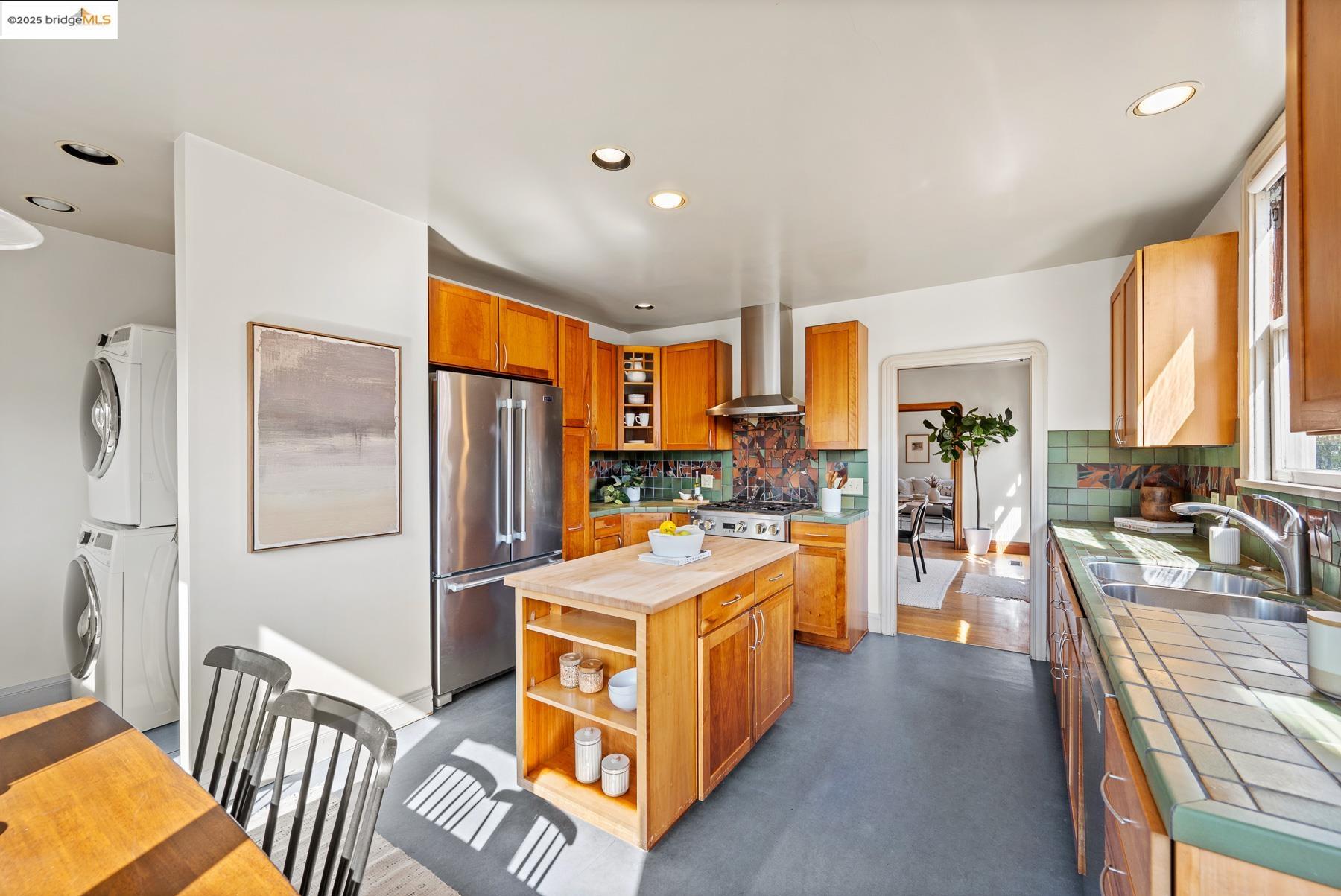 1614 Posen Avenue Berkeley, CA 94707 - Photo 26 of 60 a large kitchen with a large window and stainless steel appliances