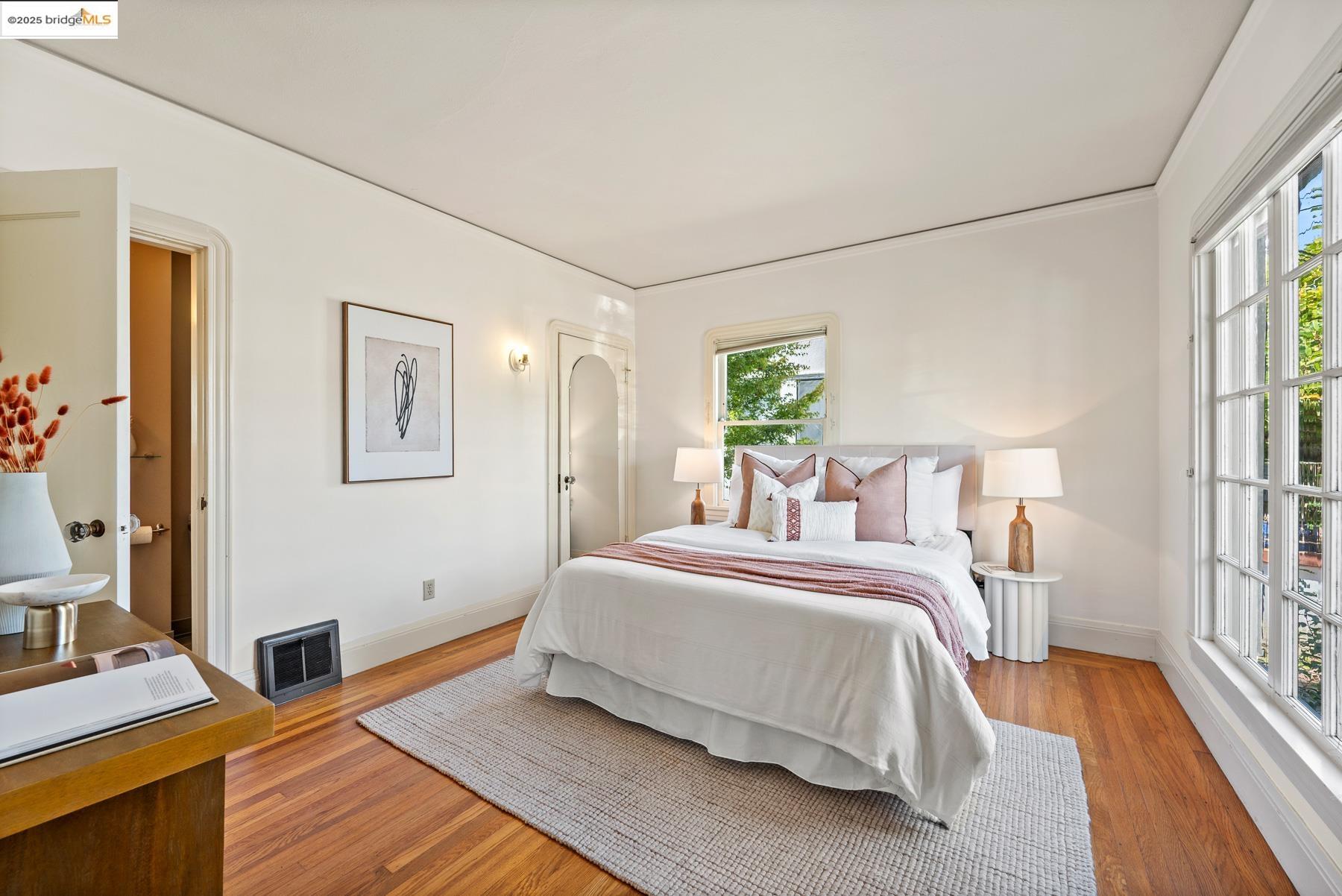 1614 Posen Avenue Berkeley, CA 94707 - Photo 28 of 60 a bedroom with a bed and a wooden floor