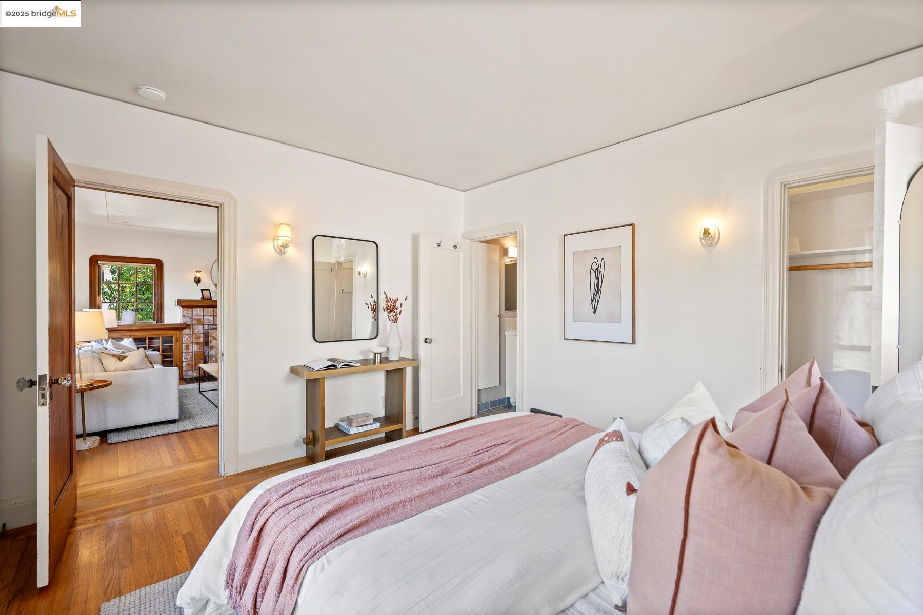 1614 Posen Avenue Berkeley, CA 94707 - Photo 29 of 60 a bedroom with a bed and a large mirror