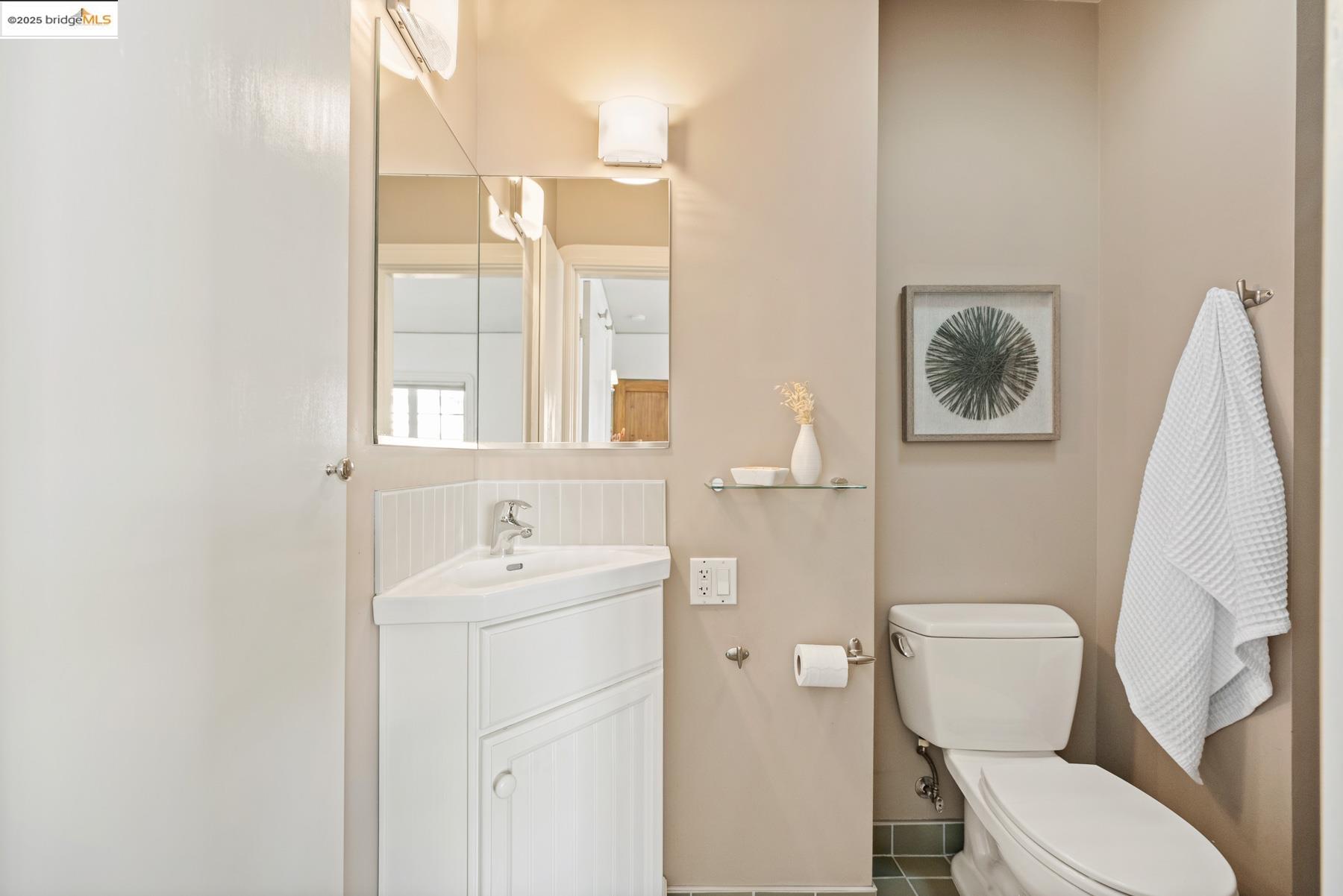 1614 Posen Avenue Berkeley, CA 94707 - Photo 30 of 60 a bathroom with a toilet sink and mirror