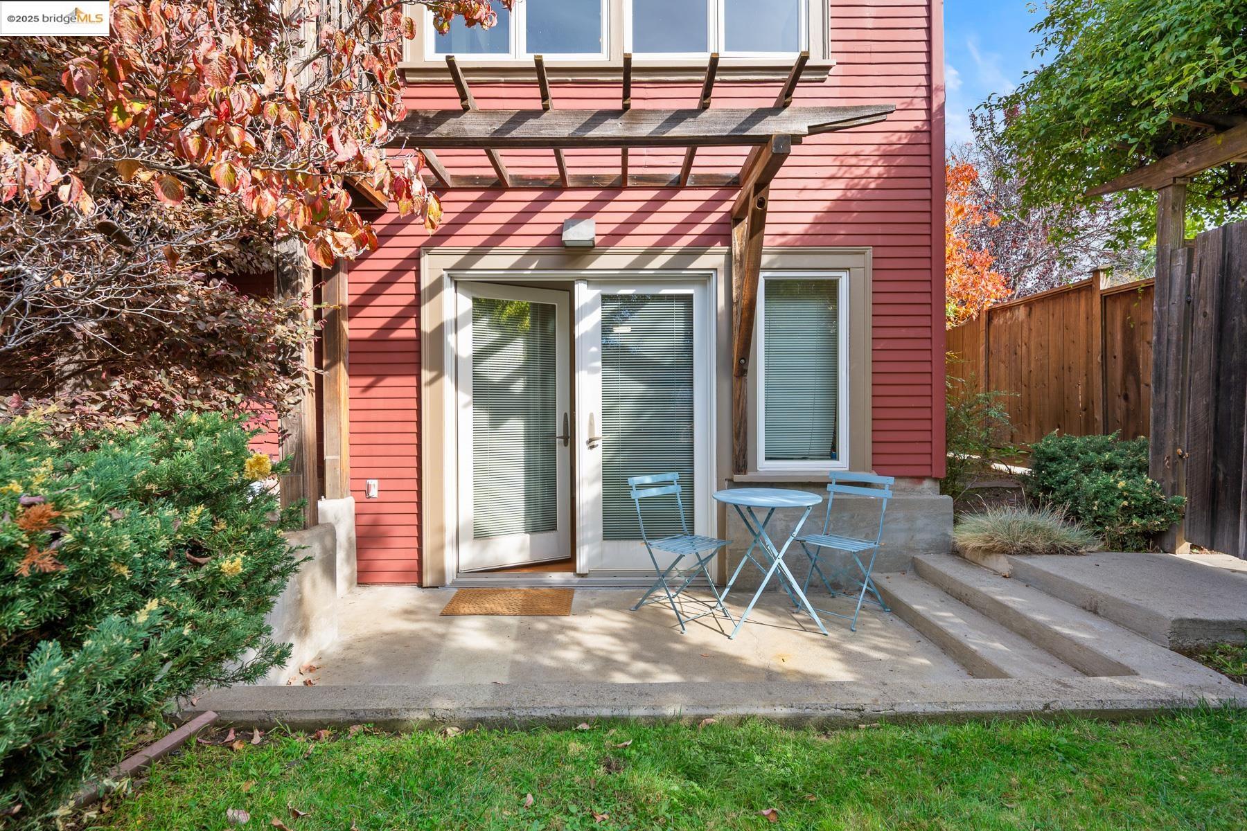 1614 Posen Avenue Berkeley, CA 94707 - Photo 41 of 60 a view of a chair and table in the backyard of the house