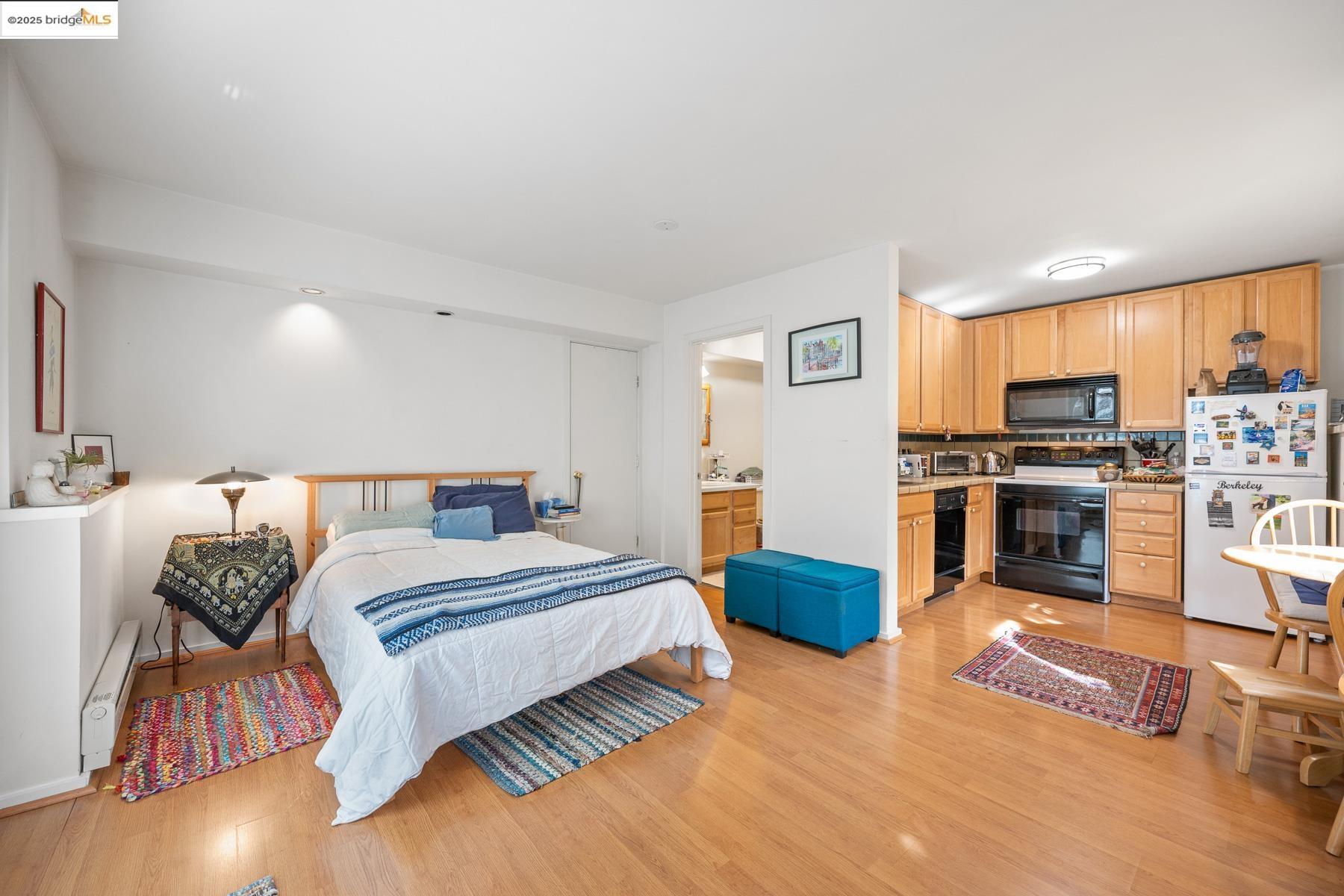 1614 Posen Avenue Berkeley, CA 94707 - Photo 45 of 60 a bedroom with a bed and a television