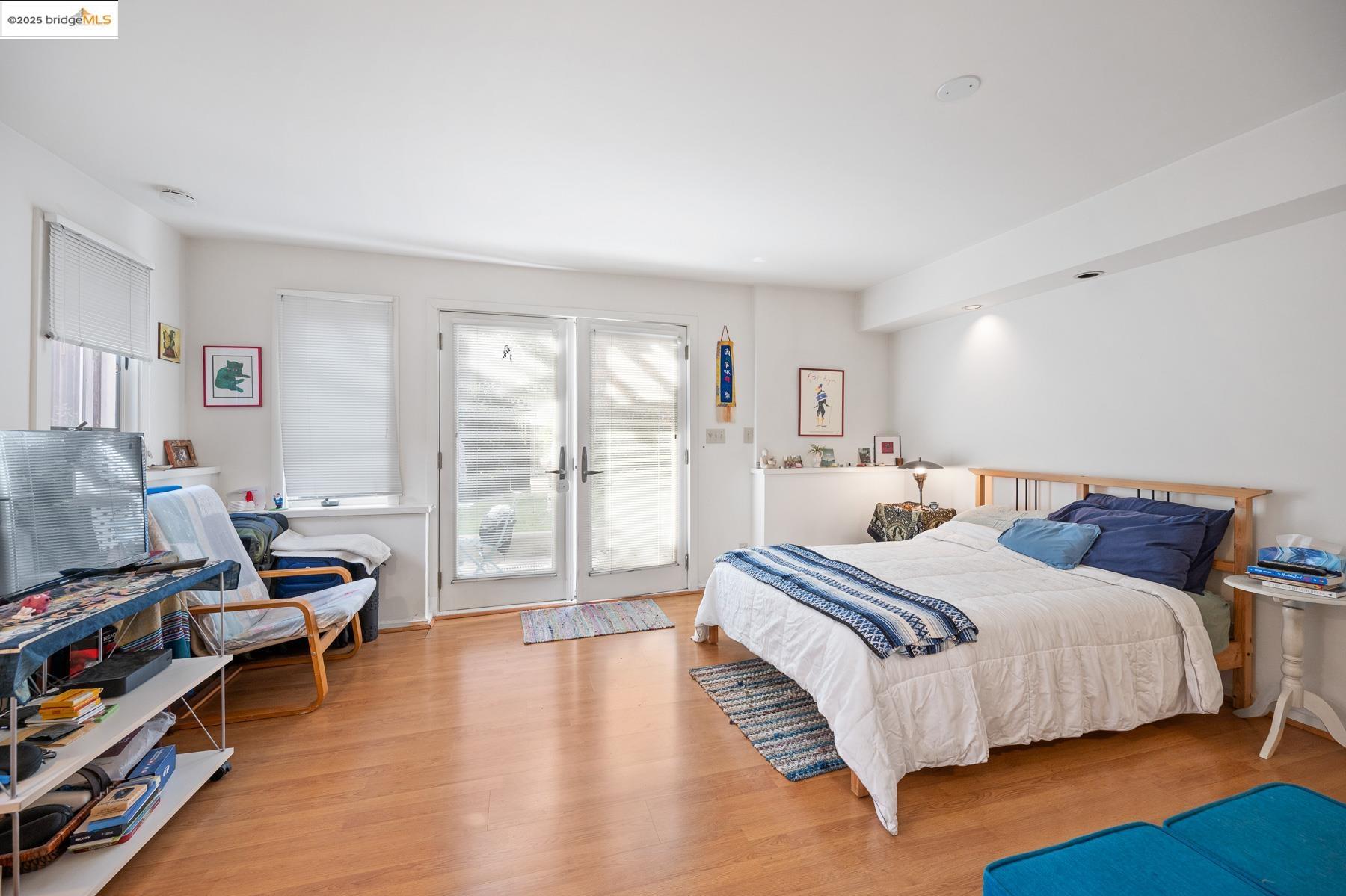 1614 Posen Avenue Berkeley, CA 94707 - Photo 46 of 60 a spacious bedroom with a bed and a book shelf