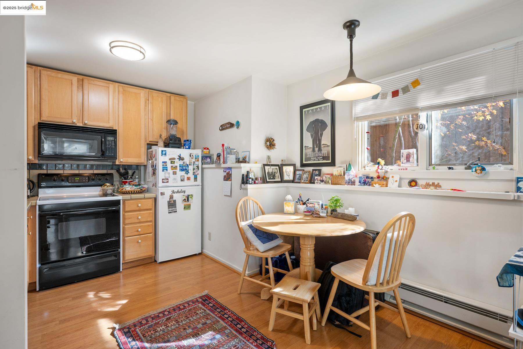 1614 Posen Avenue Berkeley, CA 94707 - Photo 47 of 60 a view of a dining room with furniture window and wooden floor