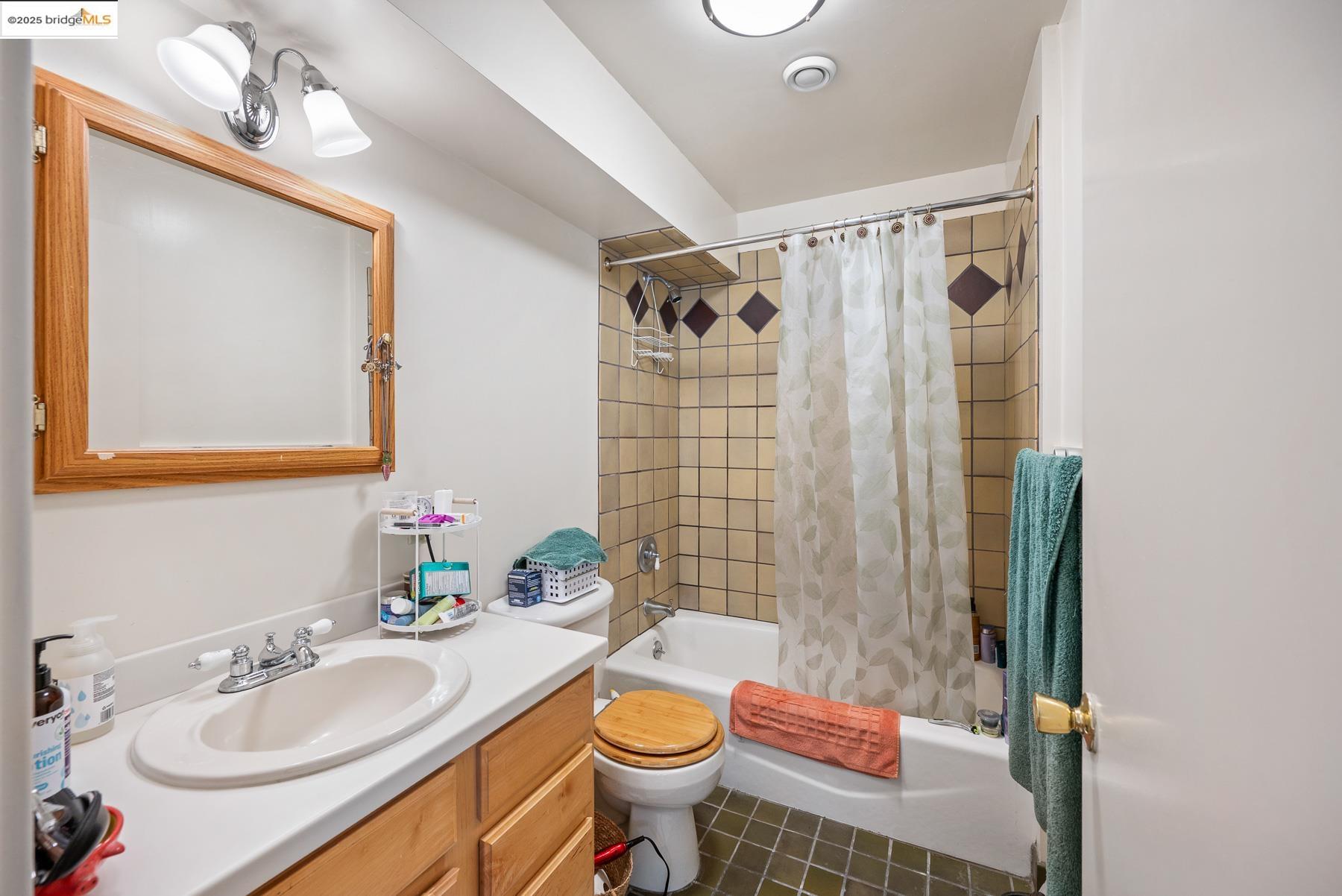 1614 Posen Avenue Berkeley, CA 94707 - Photo 49 of 60 a bathroom with a sink toilet and shower