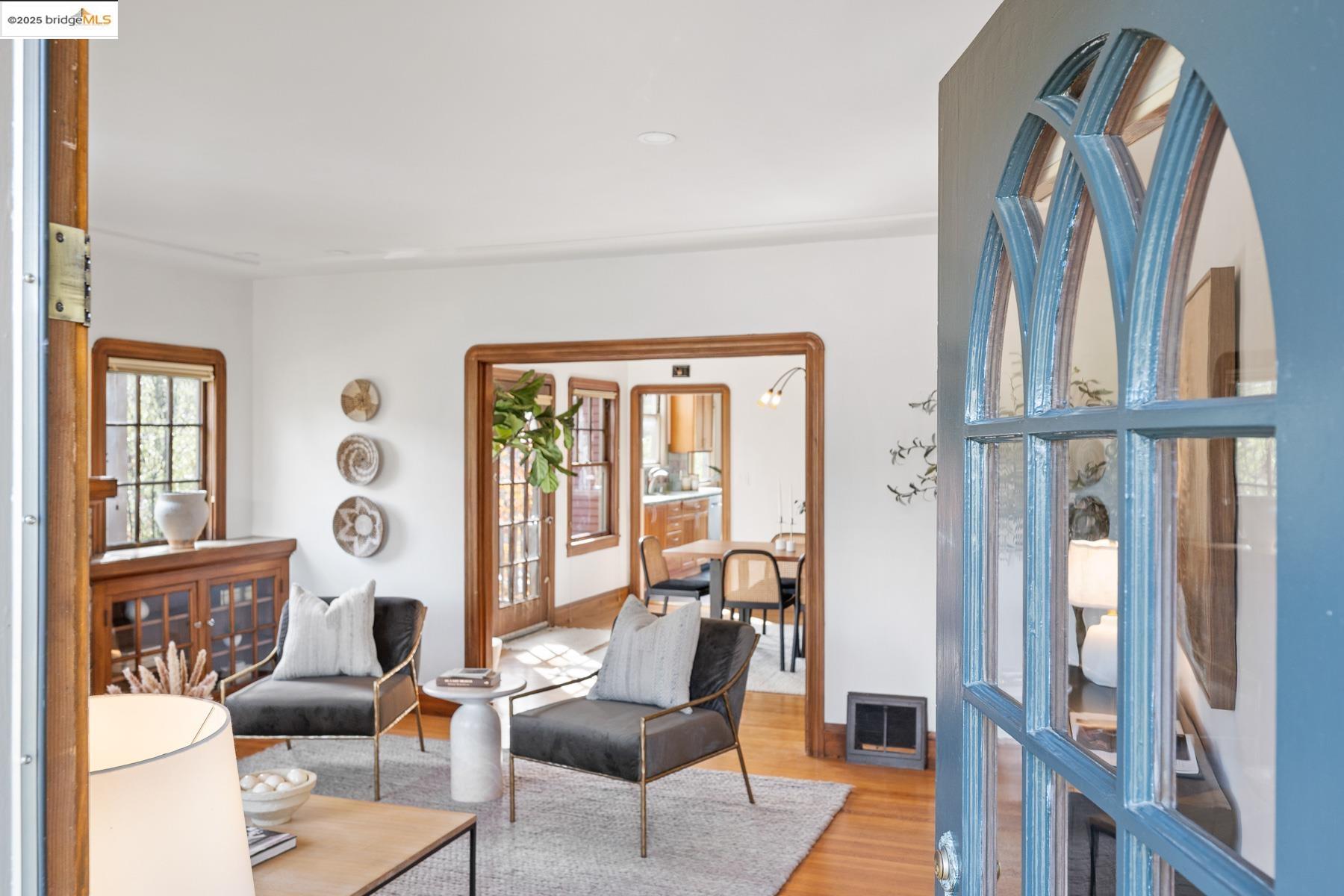 1614 Posen Avenue Berkeley, CA 94707 - Photo 5 of 60 a living room with furniture and floor to ceiling windows