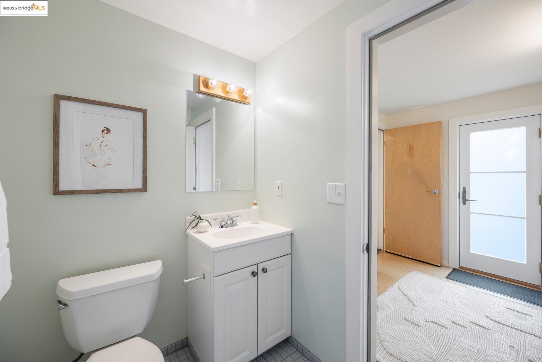 1614 Posen Avenue Berkeley, CA 94707 - Photo 56 of 60 a bathroom with a toilet sink and mirror